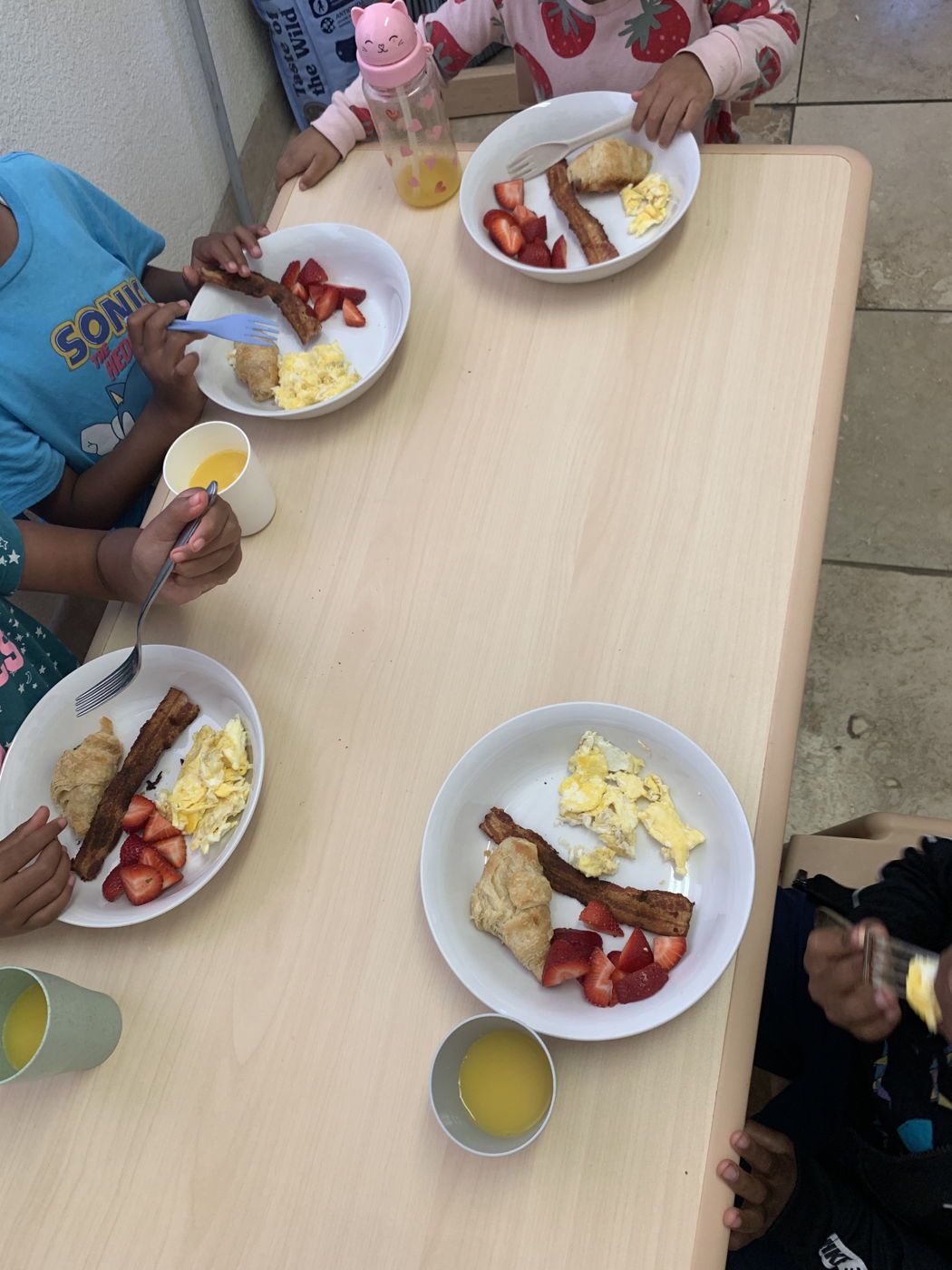 Plates of breakfast on a low table
