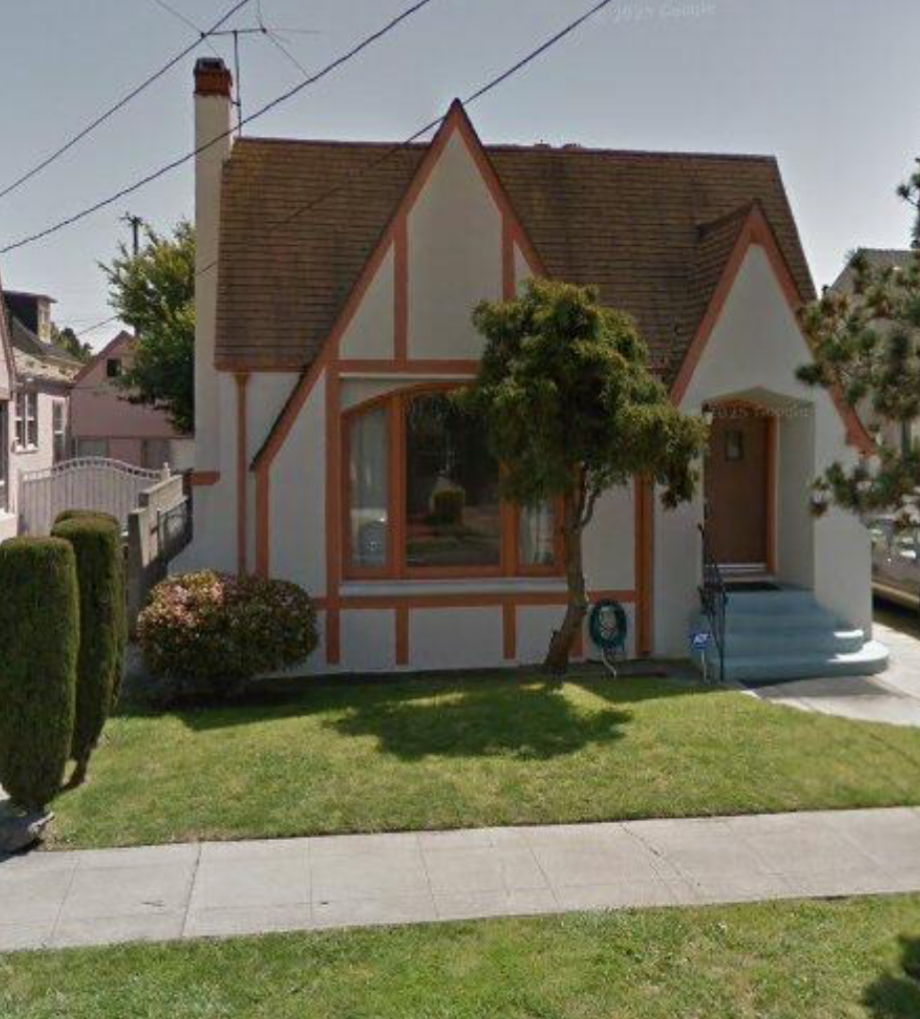 The front of the daycare home, a Tudor-style house with a green lawn